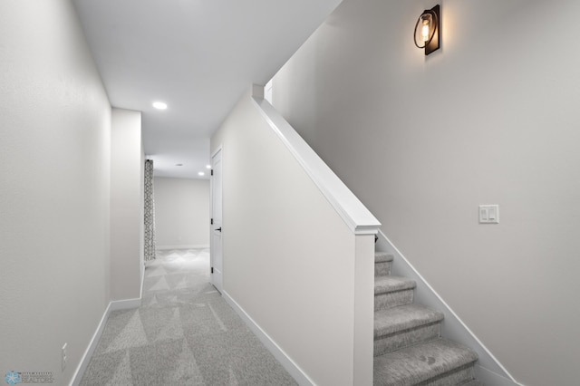 hall featuring baseboards, stairway, carpet flooring, and recessed lighting