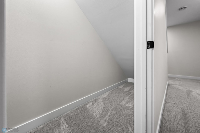 interior space with carpet flooring and baseboards