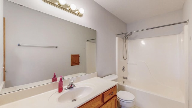 full bathroom featuring toilet, vanity, and bathing tub / shower combination