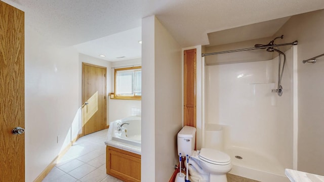 bathroom featuring tile patterned flooring, walk in shower, toilet, a bath, and a textured ceiling