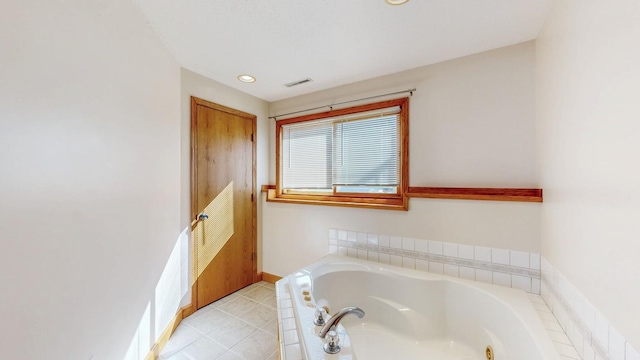 bathroom with tile patterned floors, visible vents, a garden tub, recessed lighting, and baseboards