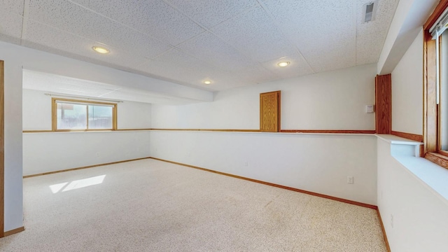 carpeted spare room with visible vents, recessed lighting, and baseboards