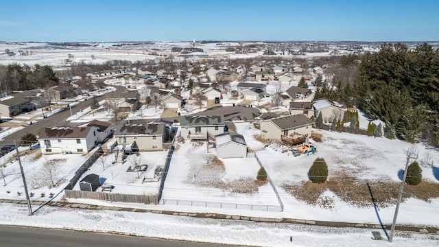 snowy aerial view featuring a residential view