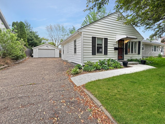6915 11th Ave S, Richfield, MN 55423 - view of front of house with a garage, an outbuilding, and a front yard