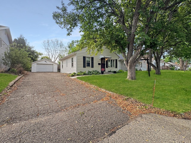6915 11th Ave S, Richfield, MN 55423 - view of front of property with an outbuilding, a garage, driveway, and a front lawn