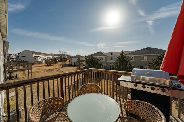 balcony with central AC, a residential view, area for grilling, and outdoor dining space