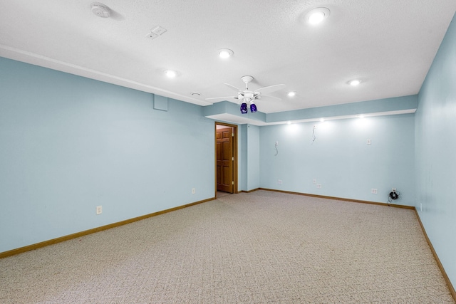 empty room featuring recessed lighting, light colored carpet, a ceiling fan, and baseboards