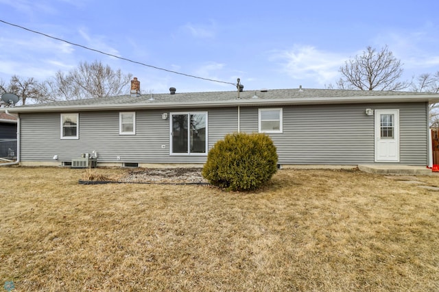 3129 7th St N, Fargo, ND 58102 - back of house featuring a yard, a chimney, and roof with shingles