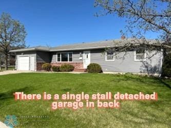 3129 7th St N, Fargo, ND 58102 - ranch-style house with an attached garage, a front yard, and concrete driveway