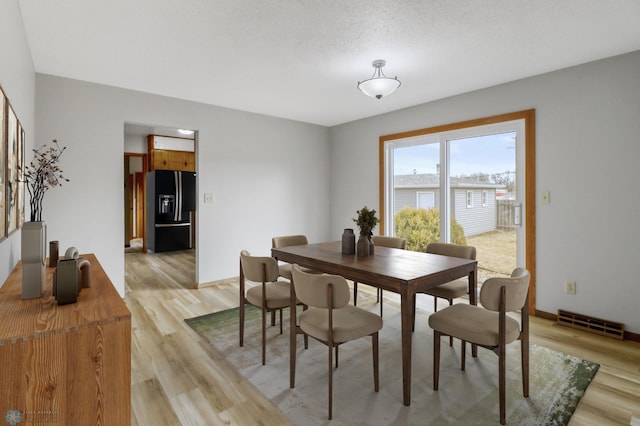 3129 7th St N, Fargo, ND 58102 - dining area featuring light wood finished floors and baseboards