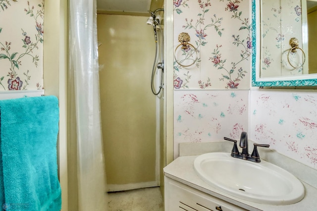 3129 7th St N, Fargo, ND 58102 - bathroom with vanity, wallpapered walls, and a shower with shower curtain