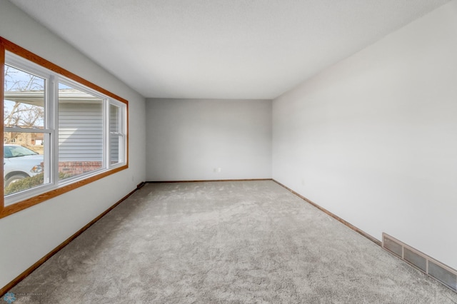 3129 7th St N, Fargo, ND 58102 - carpeted spare room featuring baseboards