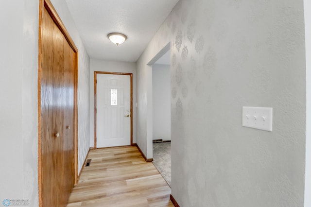 3129 7th St N, Fargo, ND 58102 - doorway to outside with light wood finished floors and baseboards