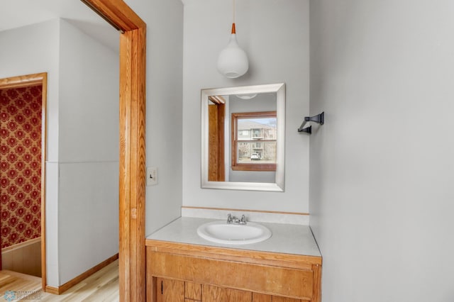 3129 7th St N, Fargo, ND 58102 - bathroom featuring vanity, a shower with shower curtain, and wood finished floors