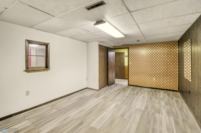 3129 7th St N, Fargo, ND 58102 - empty room with a paneled ceiling, light colored carpet, and baseboards