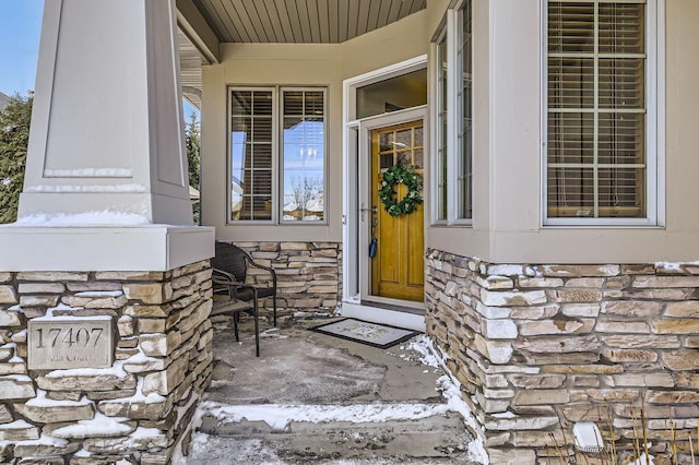 entrance to property with stone siding