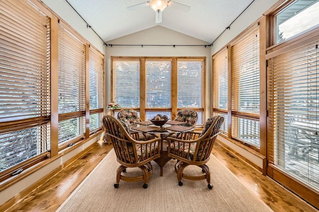 sunroom / solarium featuring a ceiling fan, visible vents, and vaulted ceiling