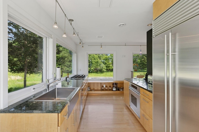 2049 Broadway St, Marine On Saint Croix, MN 55047 - kitchen featuring appliances with stainless steel finishes, light wood-style floors, healthy amount of natural light, and modern cabinets