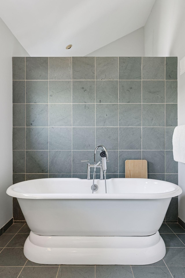 2049 Broadway St, Marine On Saint Croix, MN 55047 - bathroom with tile walls, a soaking tub, and tile patterned floors