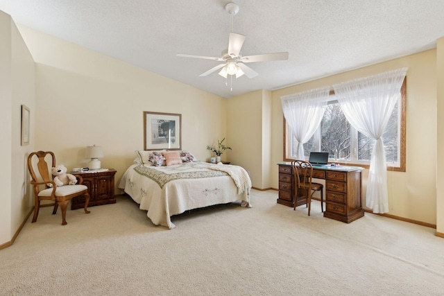 bedroom featuring lofted ceiling, light carpet, ceiling fan, a textured ceiling, and baseboards