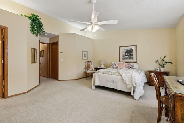 bedroom featuring light carpet, baseboards, vaulted ceiling, and a ceiling fan