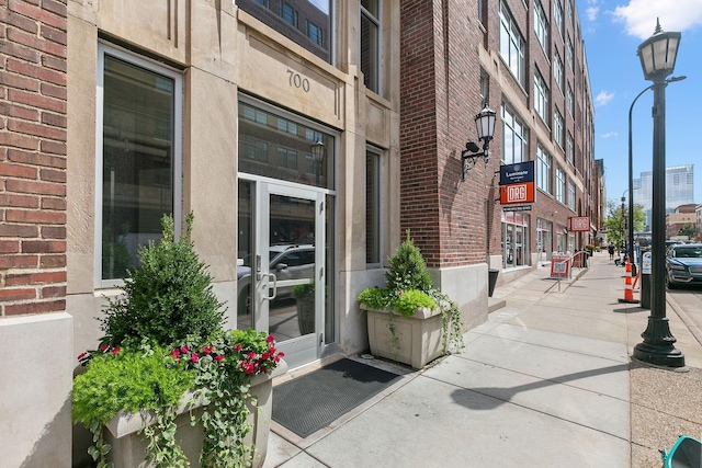 property entrance featuring brick siding