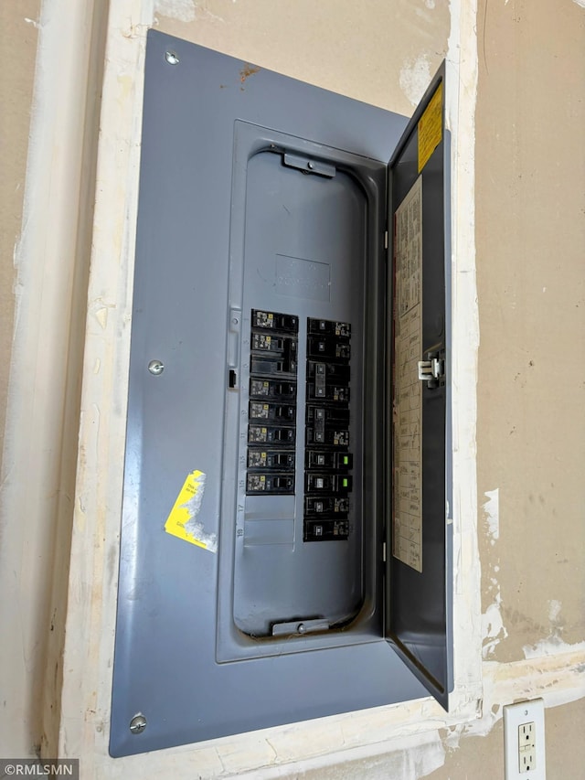 utility room featuring electric panel