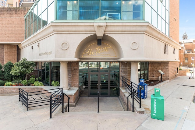 entrance to property with brick siding and french doors