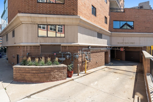 view of property featuring concrete driveway