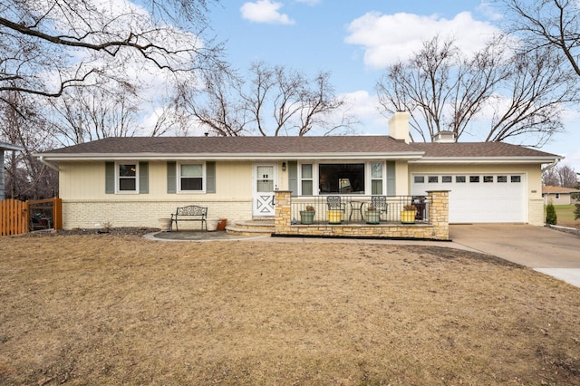 ranch-style home featuring brick siding, fence, concrete driveway, a chimney, and an attached garage