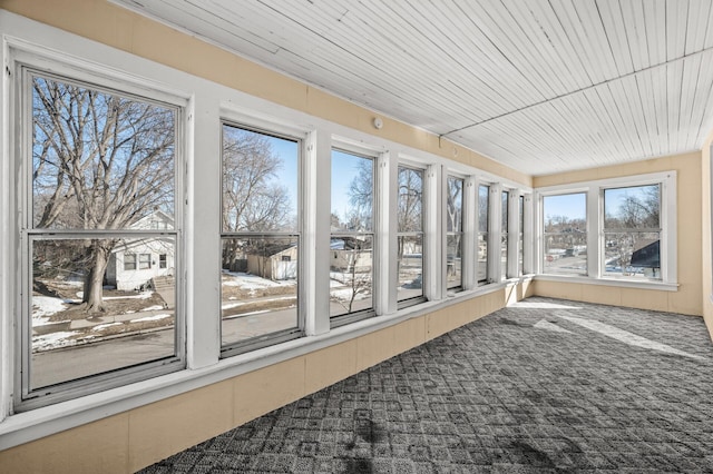 sunroom featuring wood ceiling