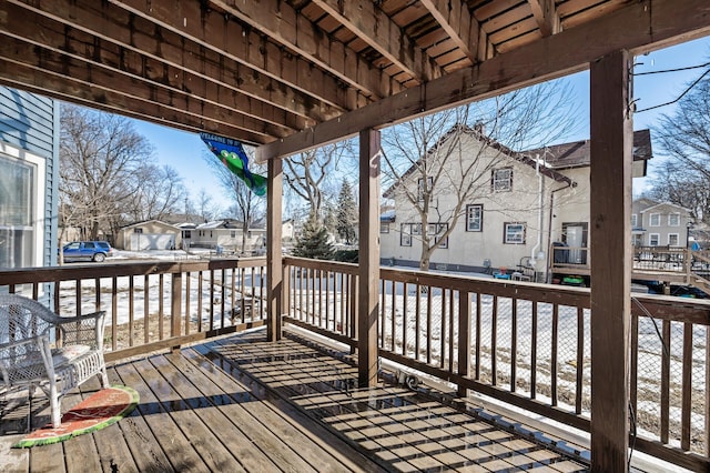 wooden terrace with a residential view