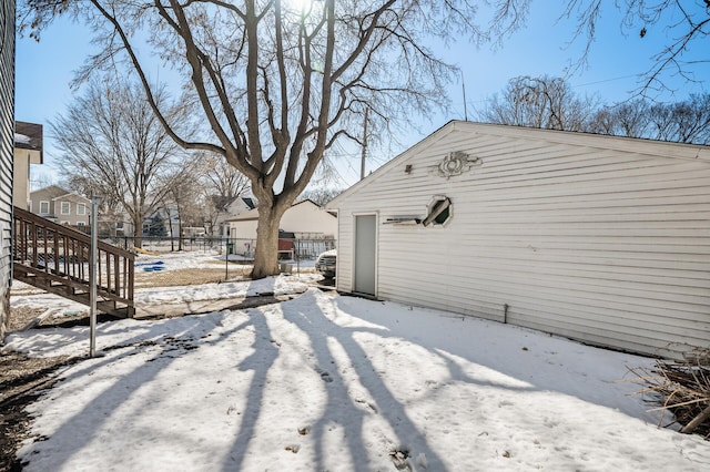 exterior space with an outbuilding and fence