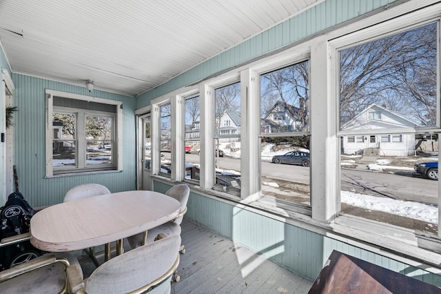 sunroom with a residential view