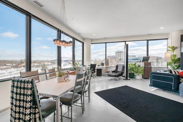 sunroom / solarium with a view of city and visible vents