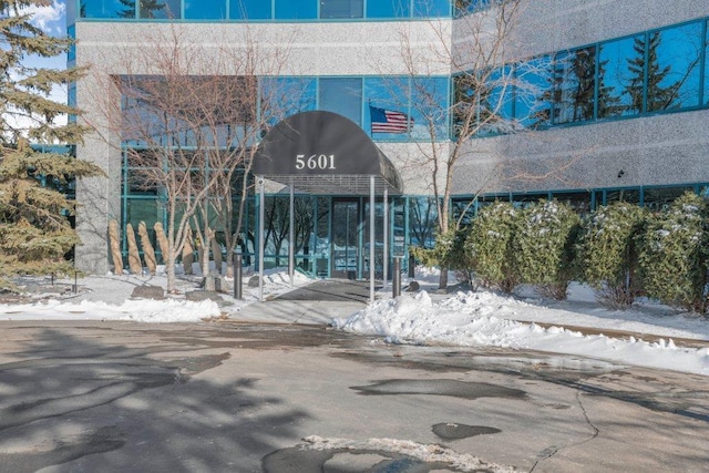 view of snow covered property entrance