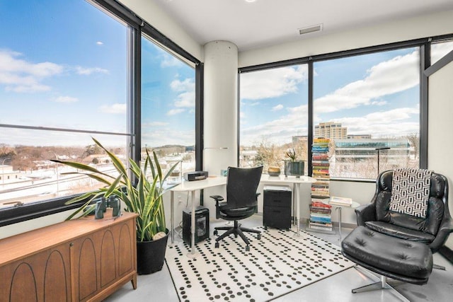 office space with visible vents and a healthy amount of sunlight
