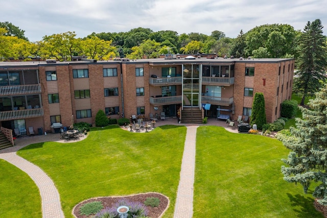 5430 Three Points Blvd Unit 131, Mound, MN 55364 - view of property featuring an outdoor fire pit and stairway