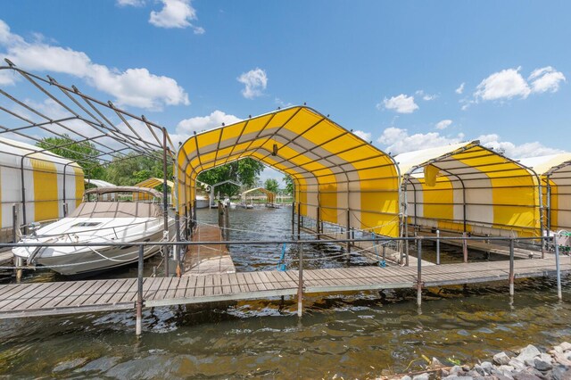 5430 Three Points Blvd Unit 131, Mound, MN 55364 - dock with boat lift and a water view