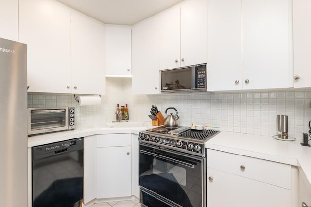 5430 Three Points Blvd Unit 131, Mound, MN 55364 - kitchen featuring black appliances, light countertops, backsplash, and white cabinets