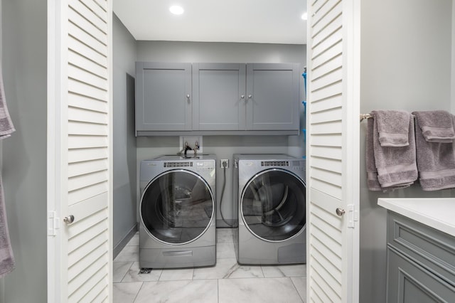 5430 Three Points Blvd Unit 131, Mound, MN 55364 - laundry room with cabinet space, washer and dryer, recessed lighting, and light tile patterned flooring