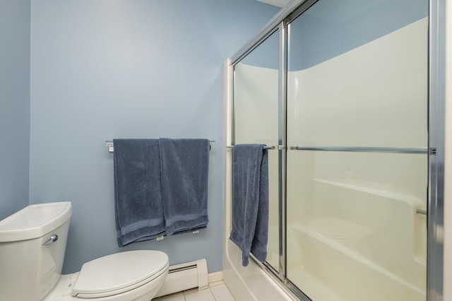 5430 Three Points Blvd Unit 131, Mound, MN 55364 - full bath featuring a baseboard radiator, toilet, tile patterned floors, enclosed tub / shower combo, and baseboards
