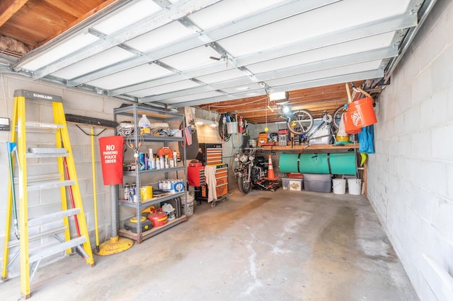 5430 Three Points Blvd Unit 131, Mound, MN 55364 - garage featuring concrete block wall and a garage door opener