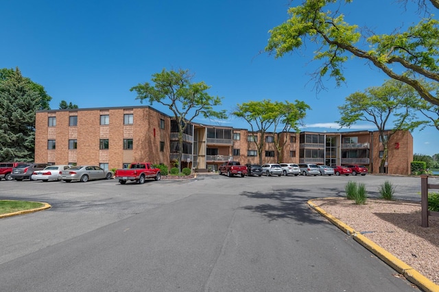 5430 Three Points Blvd Unit 131, Mound, MN 55364 - view of apartment building / complex with uncovered parking
