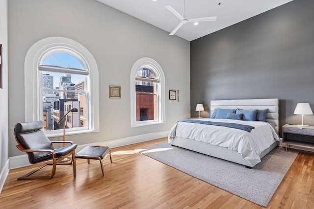 bedroom featuring baseboards and wood finished floors