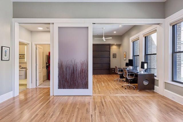 home office with recessed lighting, wood finished floors, and baseboards