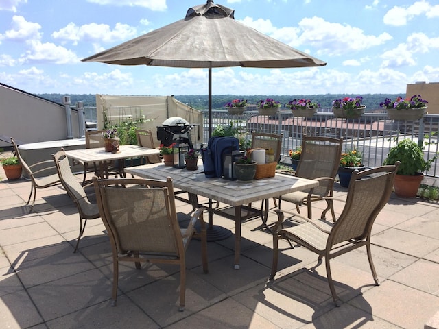 view of patio / terrace with outdoor dining area and fence