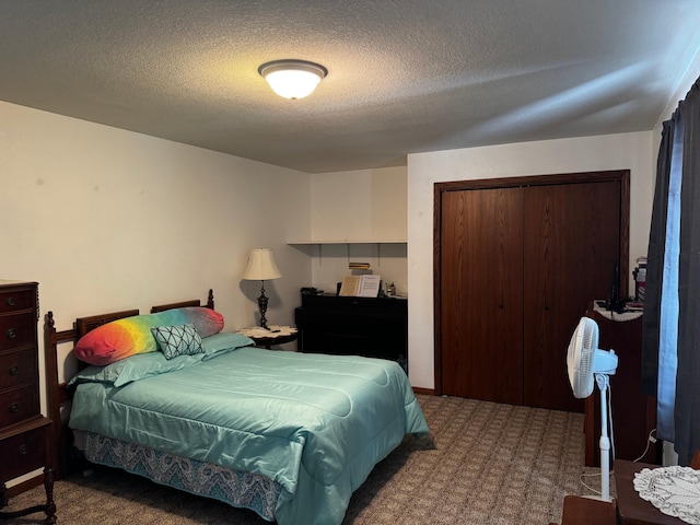 carpeted bedroom featuring a closet and a textured ceiling