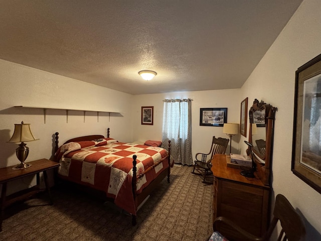 bedroom with a textured ceiling and carpet flooring