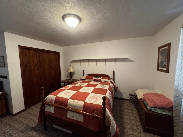 bedroom with carpet floors, a closet, a textured ceiling, and baseboards